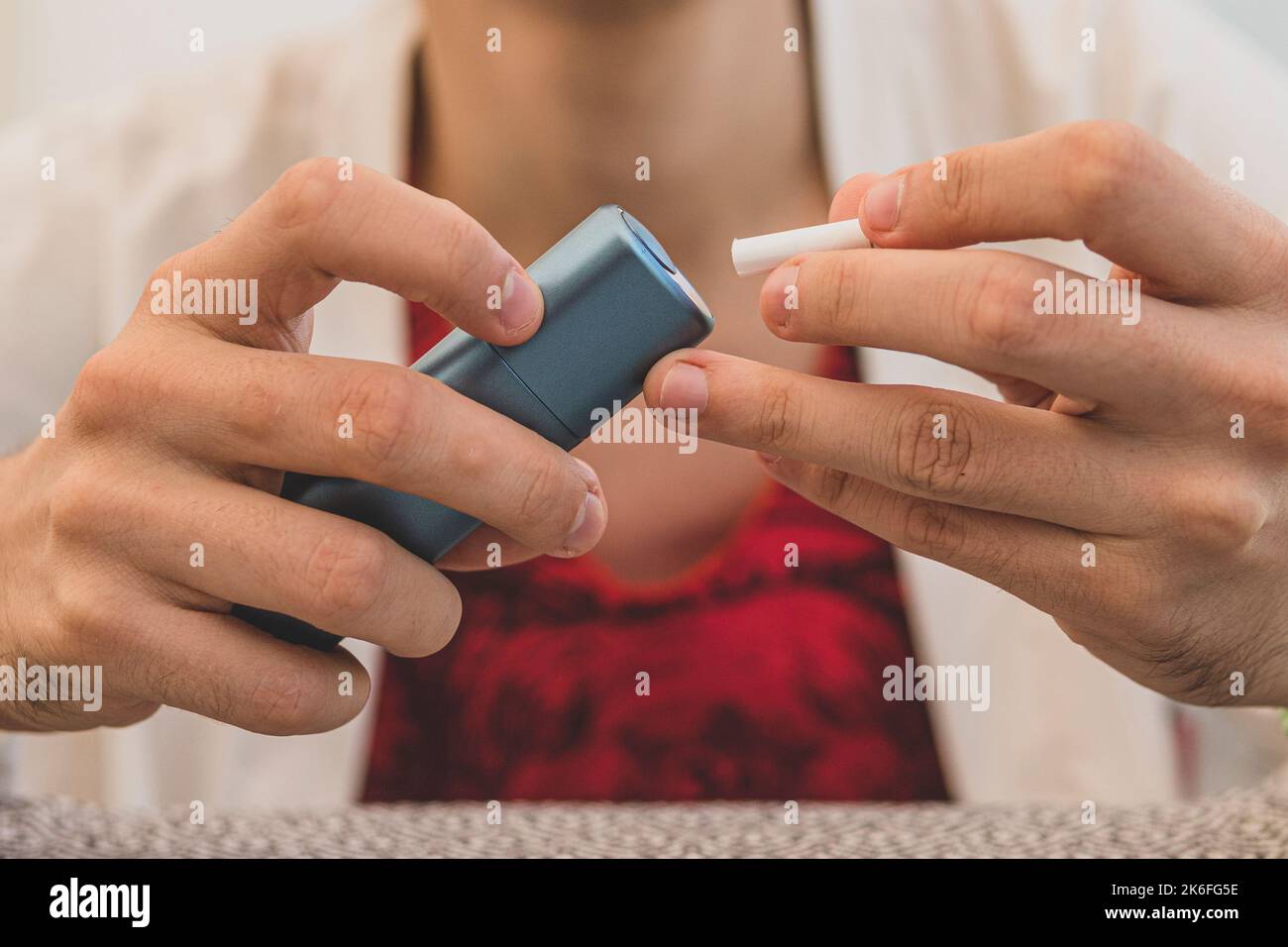 Smoker smoking hybrid smokeless cigarette device that uses real tobacco