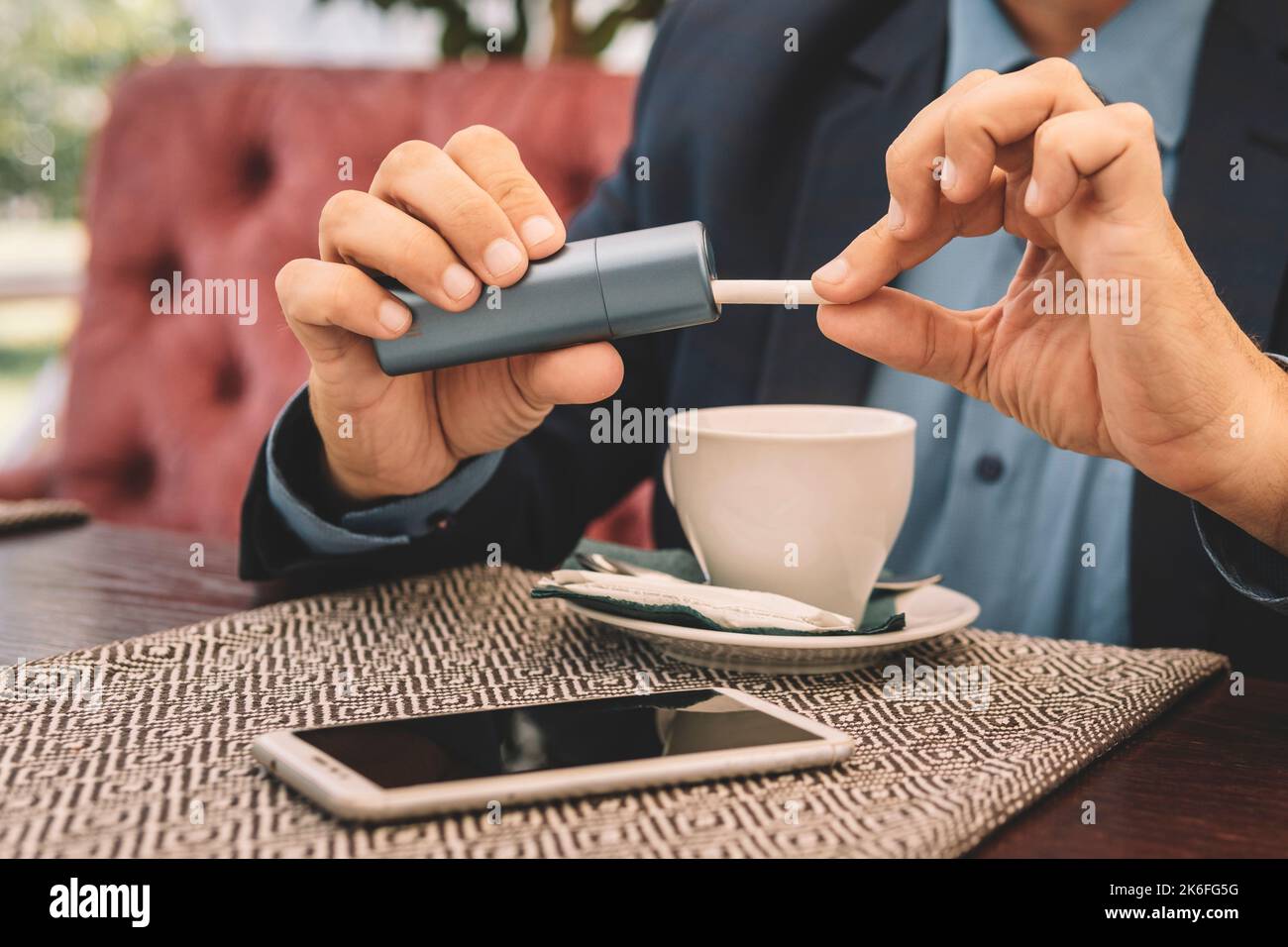 Smoker smoking hybrid smokeless cigarette device that uses real tobacco