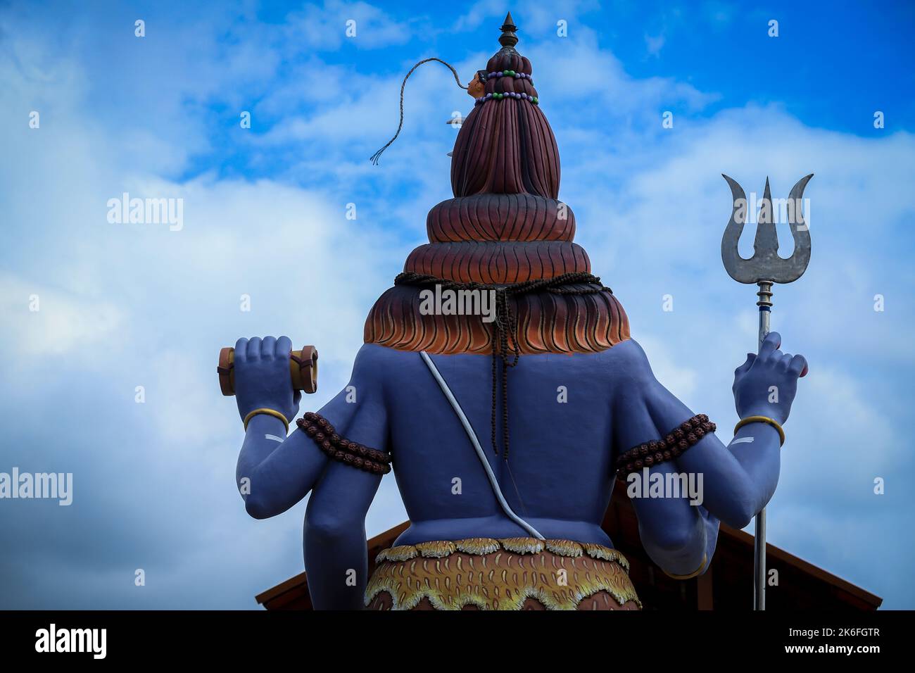 Statue of meditating Hindu god Shiva, an view from backside Stock Photo
