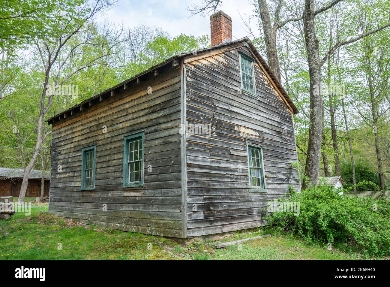 Hardwick, New Jersey, United States of America – May 1, 2017. Spangenberg Cabin at Millbrook village in Delaware Water Gap, NJ. The log cabin adjacent Stock Photo
