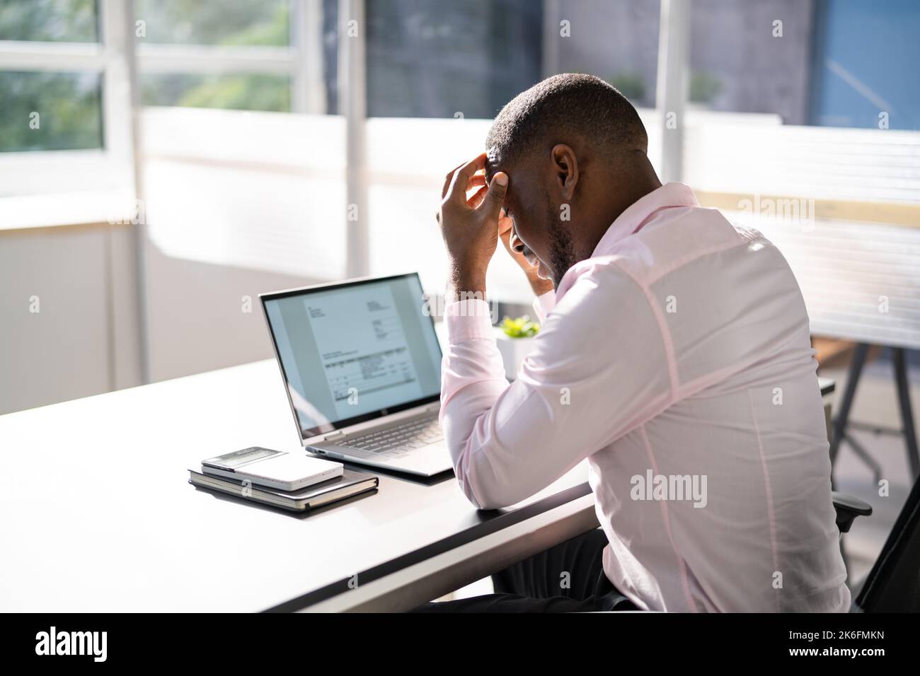 Stressed Sick African American Employee Man At Computer Stock Photo