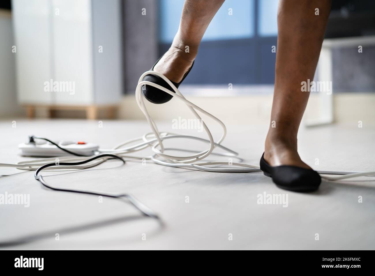 Stumble And Fall Over Wire In Office Stock Photo