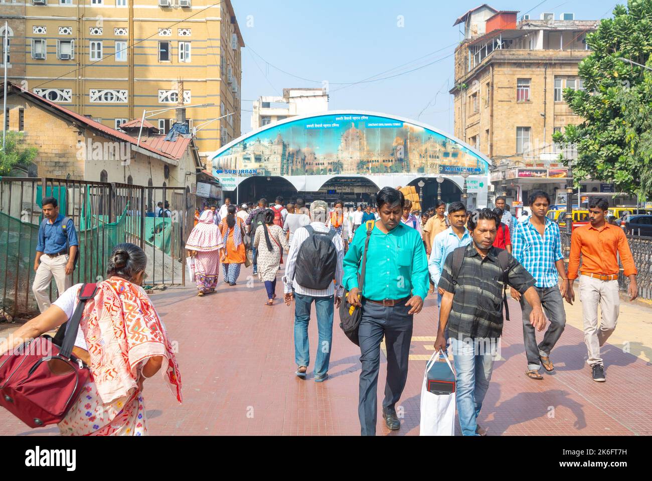 Mumbai, Maharashtra, South India, 31th of December 2019: Pedestrians and a railway station. Stock Photo