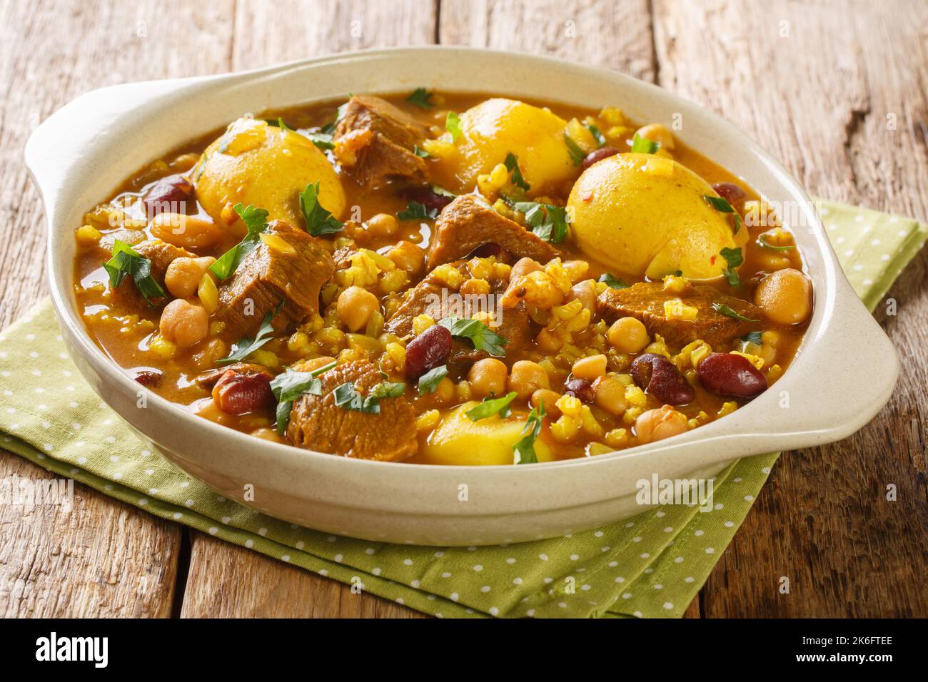 https://c8.alamy.com/comp/2K6FTEE/traditional-jewish-stew-cholent-hamin-on-sabbath-day-closeup-in-the-pan-on-the-table-horizontal-2K6FTEE.jpg