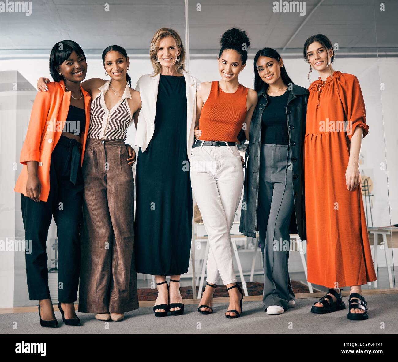 These collaborations create great things. a group of businesswoman standing in an office at work. Stock Photo