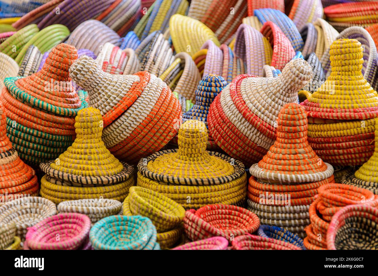 Beautiful colorful woven baskets from natural materials on market in detail view Stock Photo