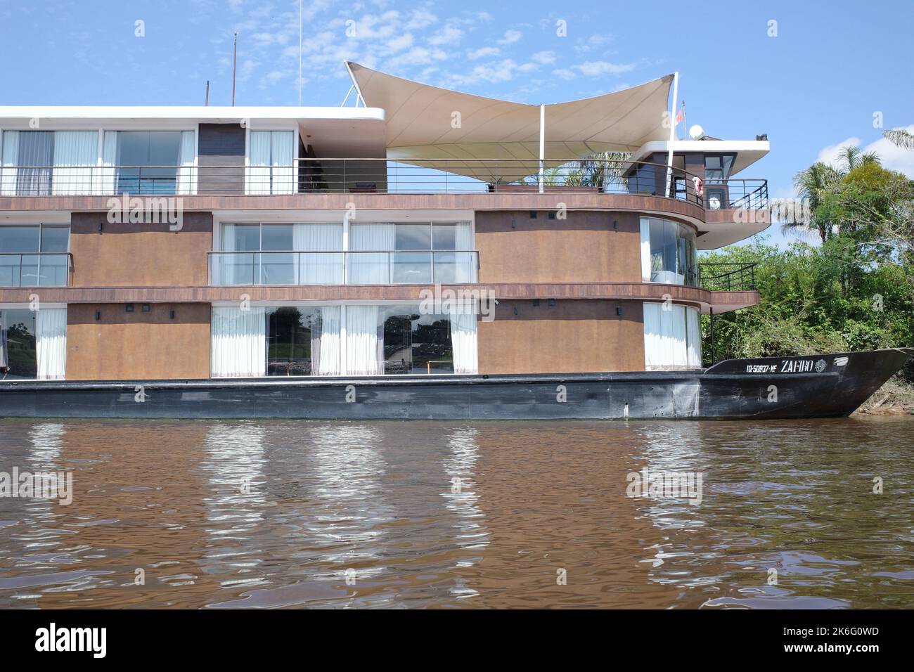 Iquitos, Peru - 27 June 2022: A cruise boat on the Amazon river near the port of Iquitos, Peru Stock Photo