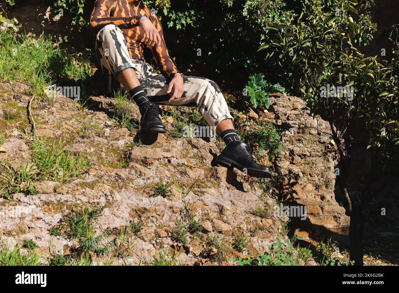 fashion model sitting in nature using camouflage clothes Stock Photo ...