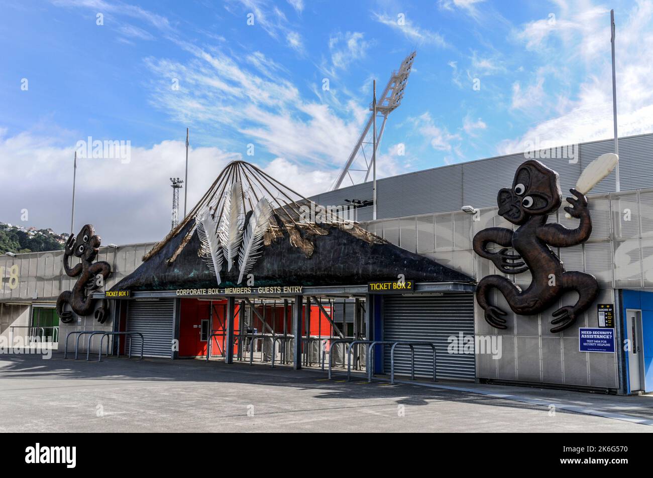 Two large Maori wooden carvings with the famous Haka, at the main entrance for VIPs at the Westpac Stadium at Waterloo Quay, Pipitea in Wellington on Stock Photo