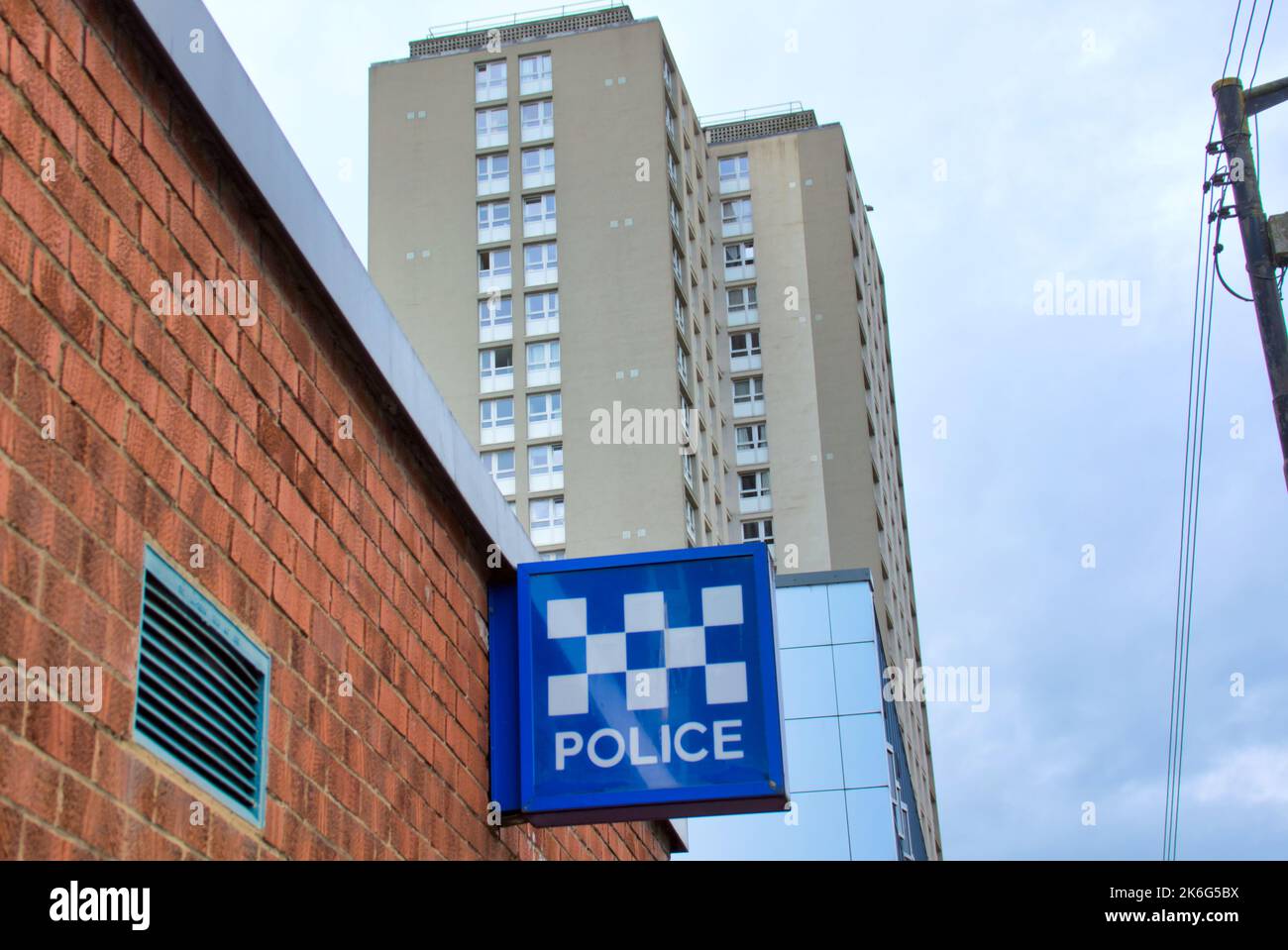 Glasgow City Centre Police Office Sign with high rise problem council housing Stock Photo
