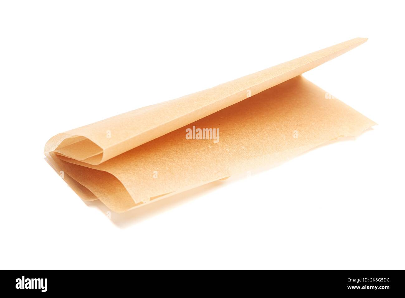 brown baking paper sheets isolated on white background Stock Photo - Alamy