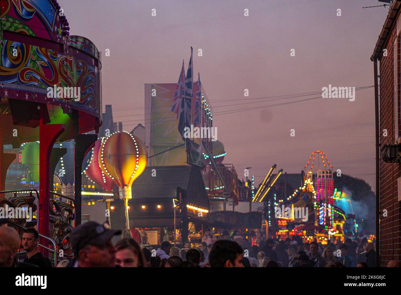 8th October 2022, Tewkesbury, Gloucestershire, England. Tewkesbury Mop Fair.  A slow shutter general view of a ride at Tewkesbury Mop Fair. Tewkesbury  Mop Fair has ran since 1199 and is one of