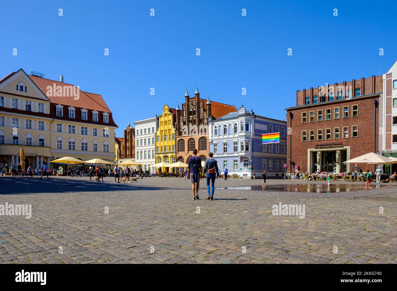 Summer tourist scene typical for the vacation season on the Old Market Square, Hanseatic Town of Stralsund, Mecklenburg-Western Pomerania, Germany. Stock Photo