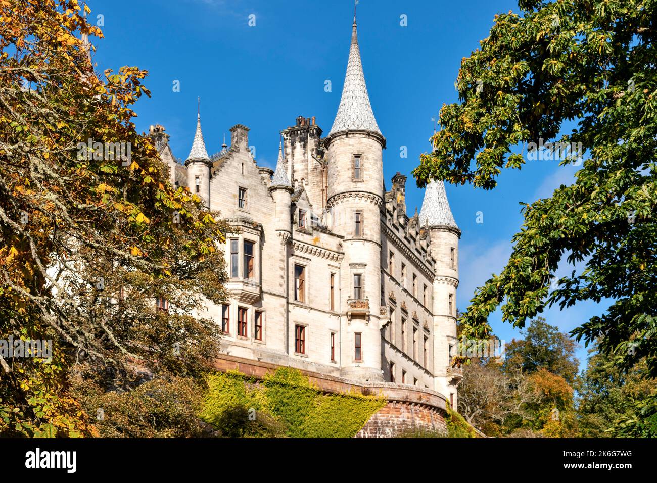 Dunrobin Castle Golspie Sutherland Scotland trees in autumn and the building with fairy tale spires Stock Photo