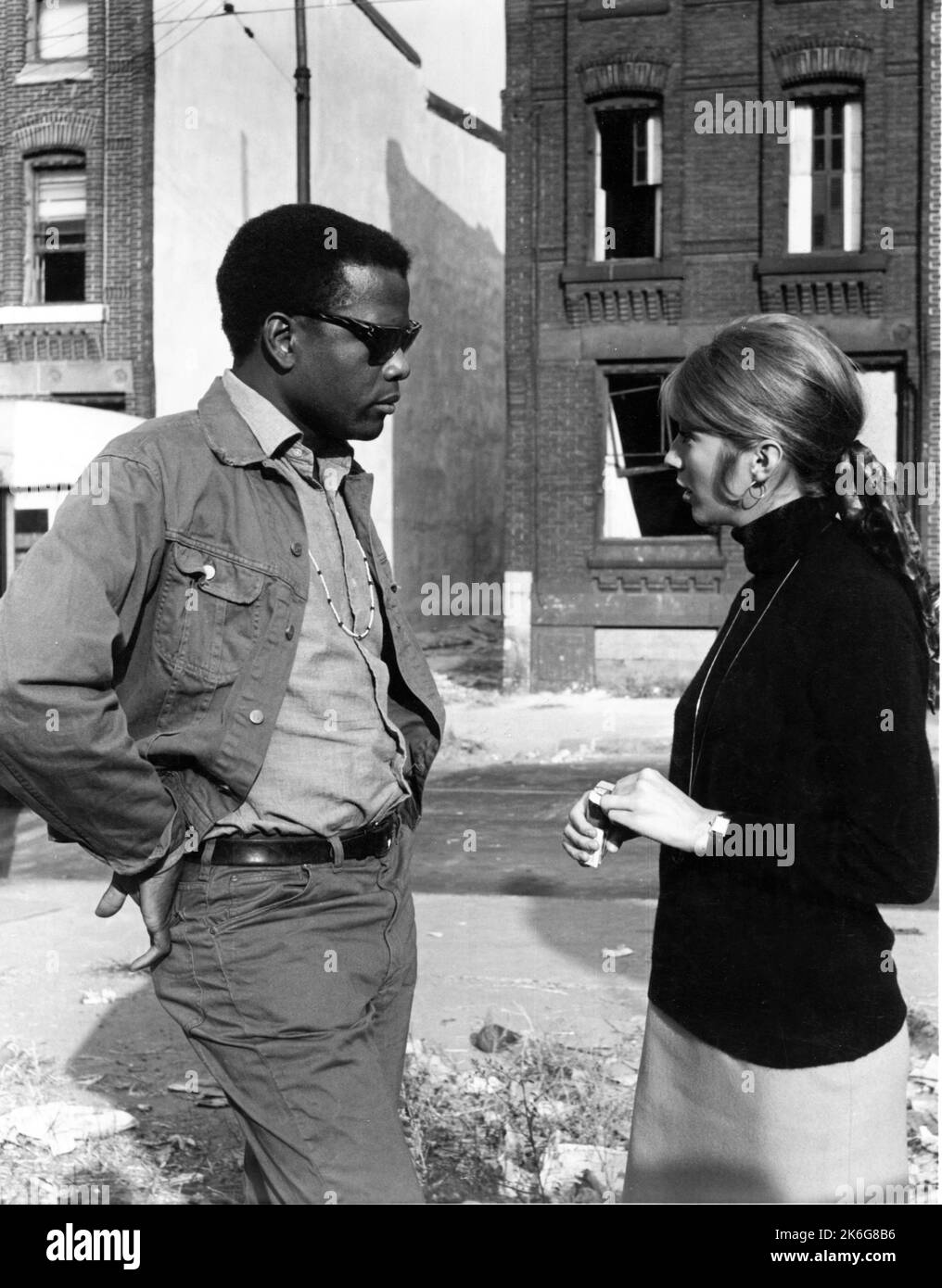 SIDNEY POITIER and JOANNA SHIMKUS in THE LOST MAN 1969 director / screenplay ROBERT ALAN AURTHUR based on the novel Odd Man Out by F.L. Green music Quincy Jones costume design Edith Head Universal Pictures Stock Photo