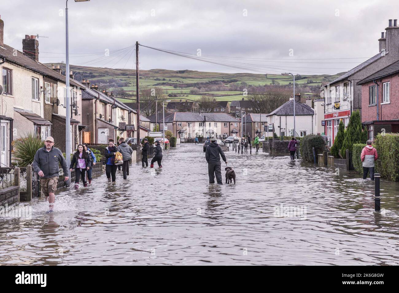 Kendal, Cumbria - December 6th 2015 - Residents negotiate a flooded road in Sandylands, Kendal in Cumbria on the 6th of December 2015 after Storm Desmond. Pic Credit: Scott CM/Alamy Live News Stock Photo