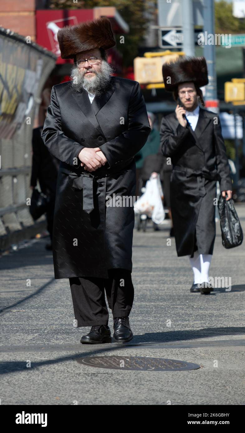 During the Jewish holiday of Sukkos, orthodox men wear fur hats called a shtreimel . In Williamsburg, Brooklyn, New York City. Stock Photo