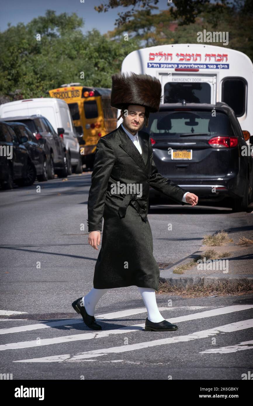 A Hasidic man, wearing a Shtreimel fur hat and high white stockings