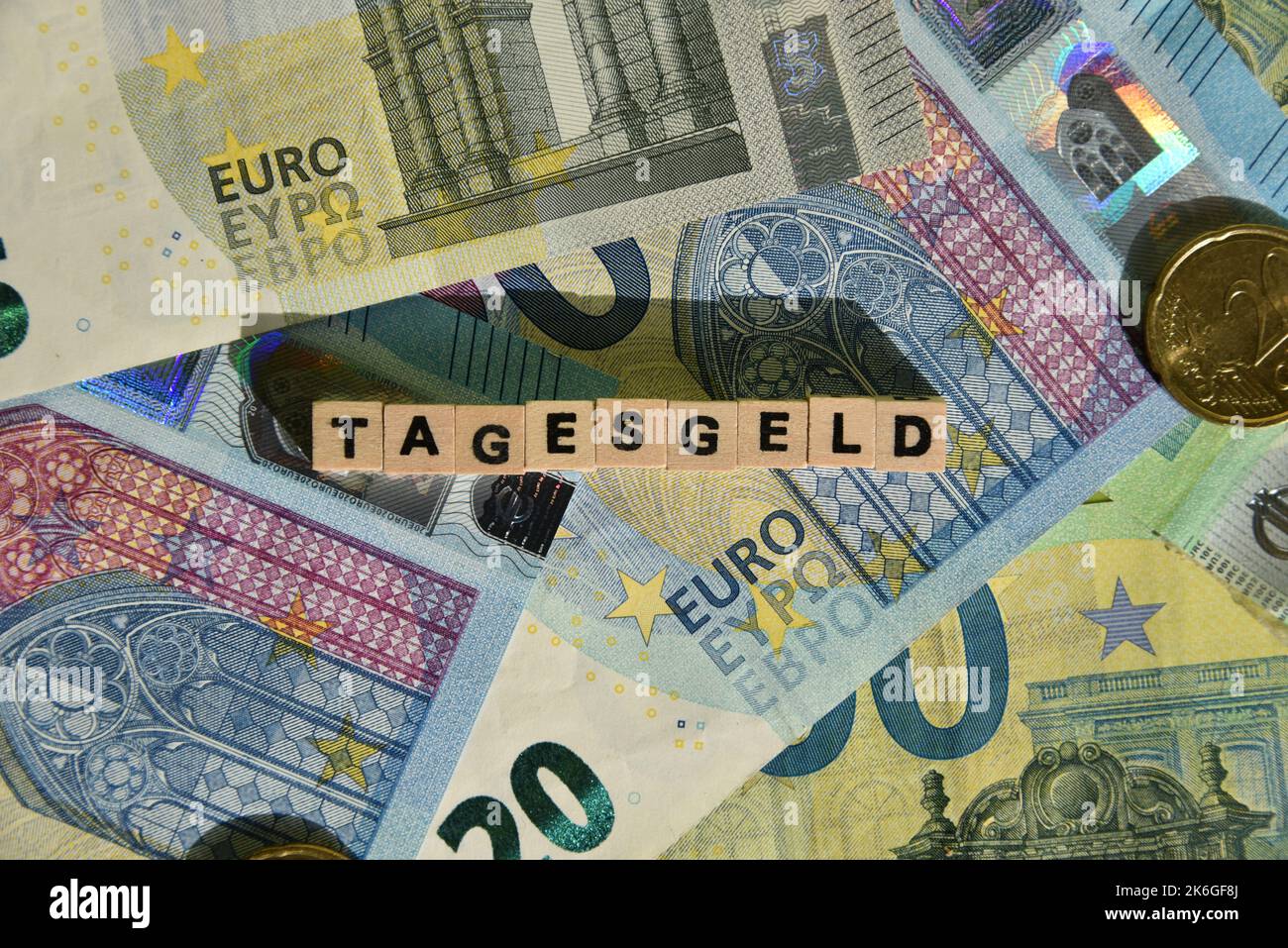 the german word Tagesgeld with wodden cubes and euro bills Stock Photo