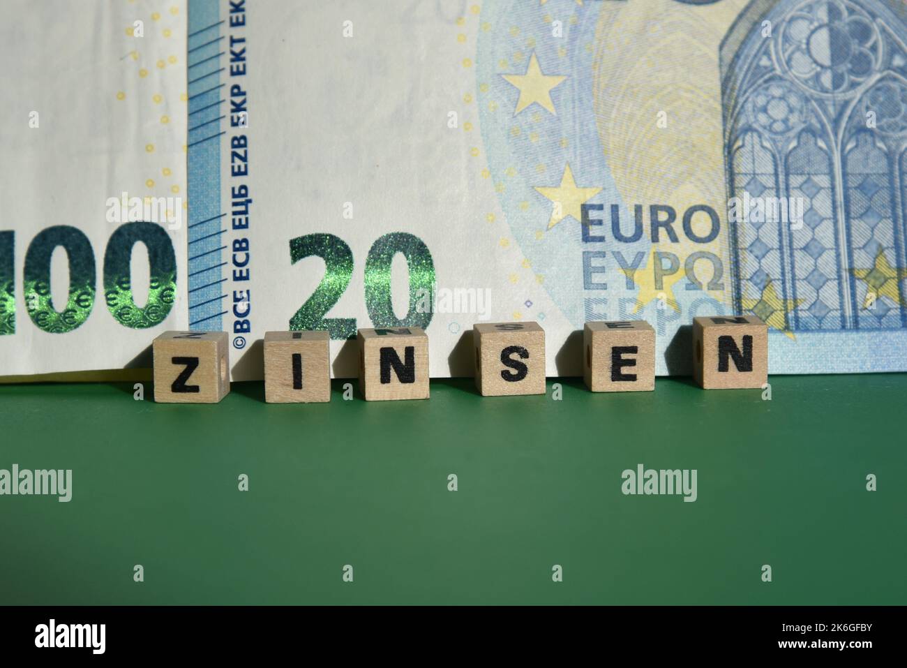 the german word for interest with wodden cubes and euro bills Stock Photo