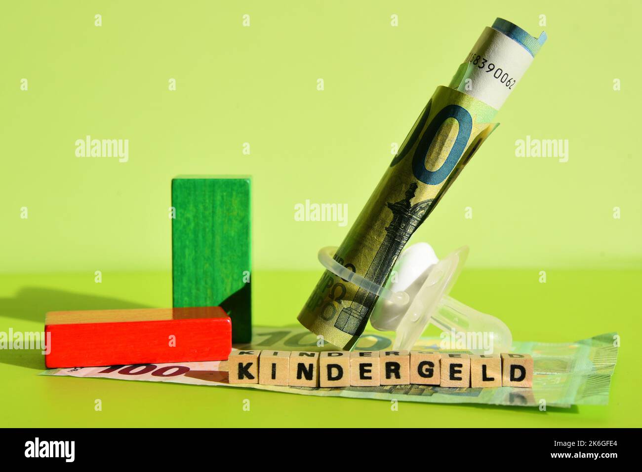 the german word for child benefit with wodden cubes and euro bills Stock Photo