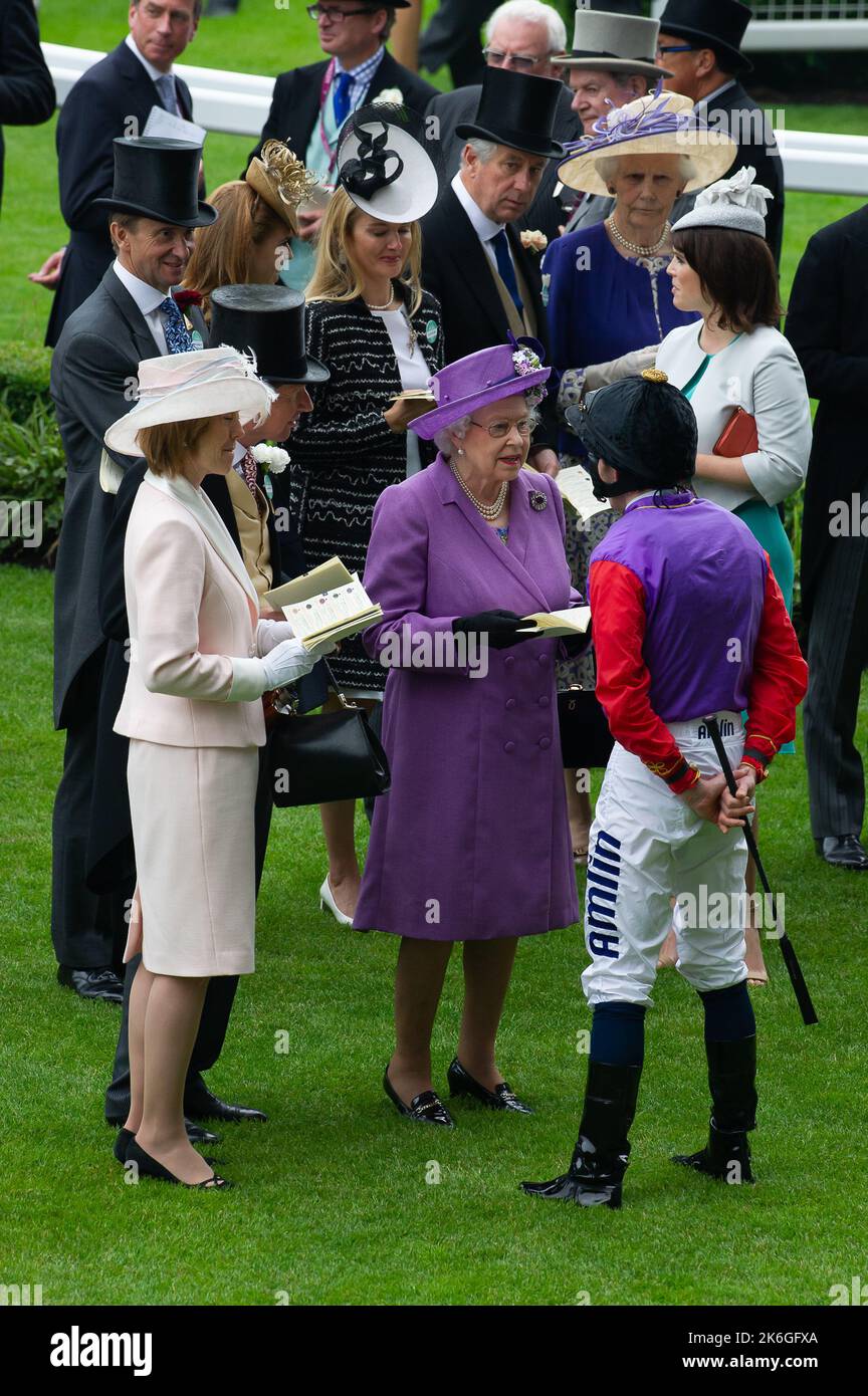 Ascot, Berkshire, UK. 20th June, 2013. Her Majesty the Queen chats to jockey Ryan Moore before he won the Ascot Gold Cup on her horse Estimate. This was an historic day as it was the first time a reigning monarch had won the Gold Cup. Estimate was ridden by jockey Ryan Moore. Queen Elizabeth II was due to the presentation for the Gold Cup but her son, the Duke of York did the presentation instead. Issue Date: 14th October 2022. Credit: Maureen McLean/Alamy Stock Photo