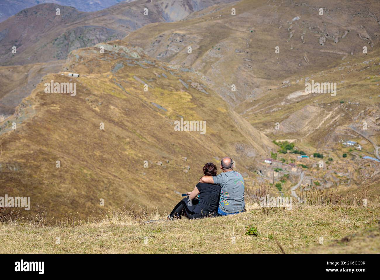 Girl sitting on high hill hi-res stock photography and images - Alamy