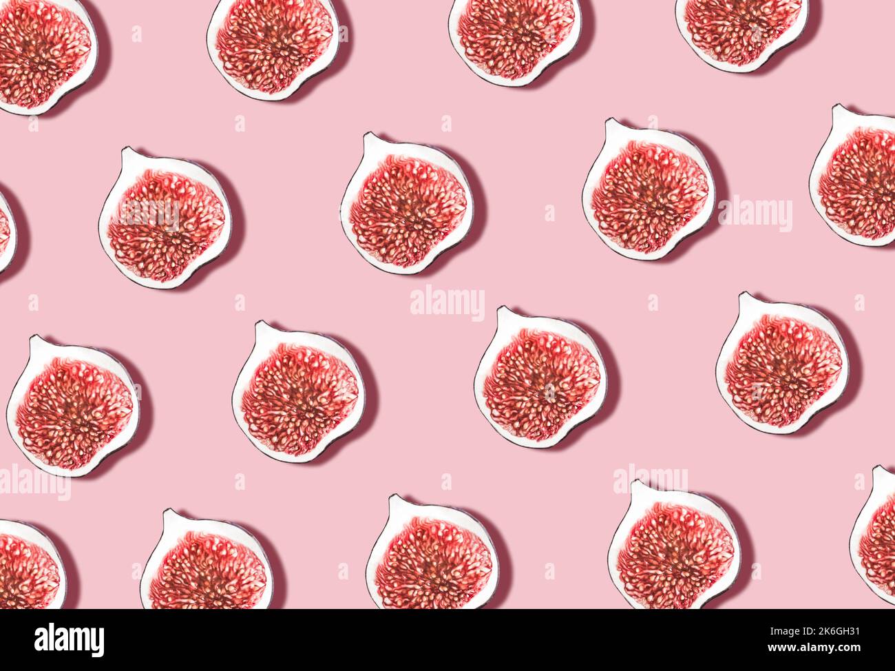 Pattern with figs. Ripe fresh fruits in rows ob pink backdrop Stock ...