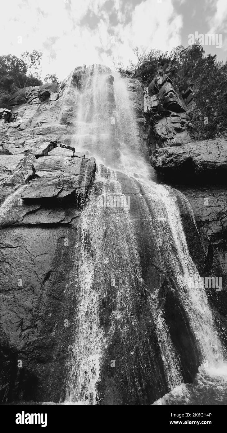 A low angle vertical greyscale of the mother and child waterfall in Hogsback Eastern Cape South Africa Stock Photo