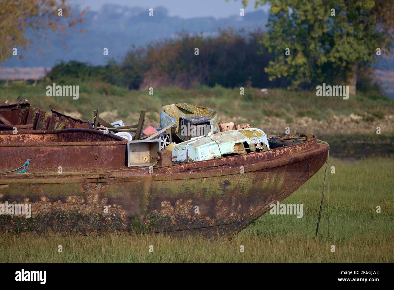 Rusting abandoned old boat wrecks at riverside park on the mud flats. Taken on 22-9-22. Stock Photo