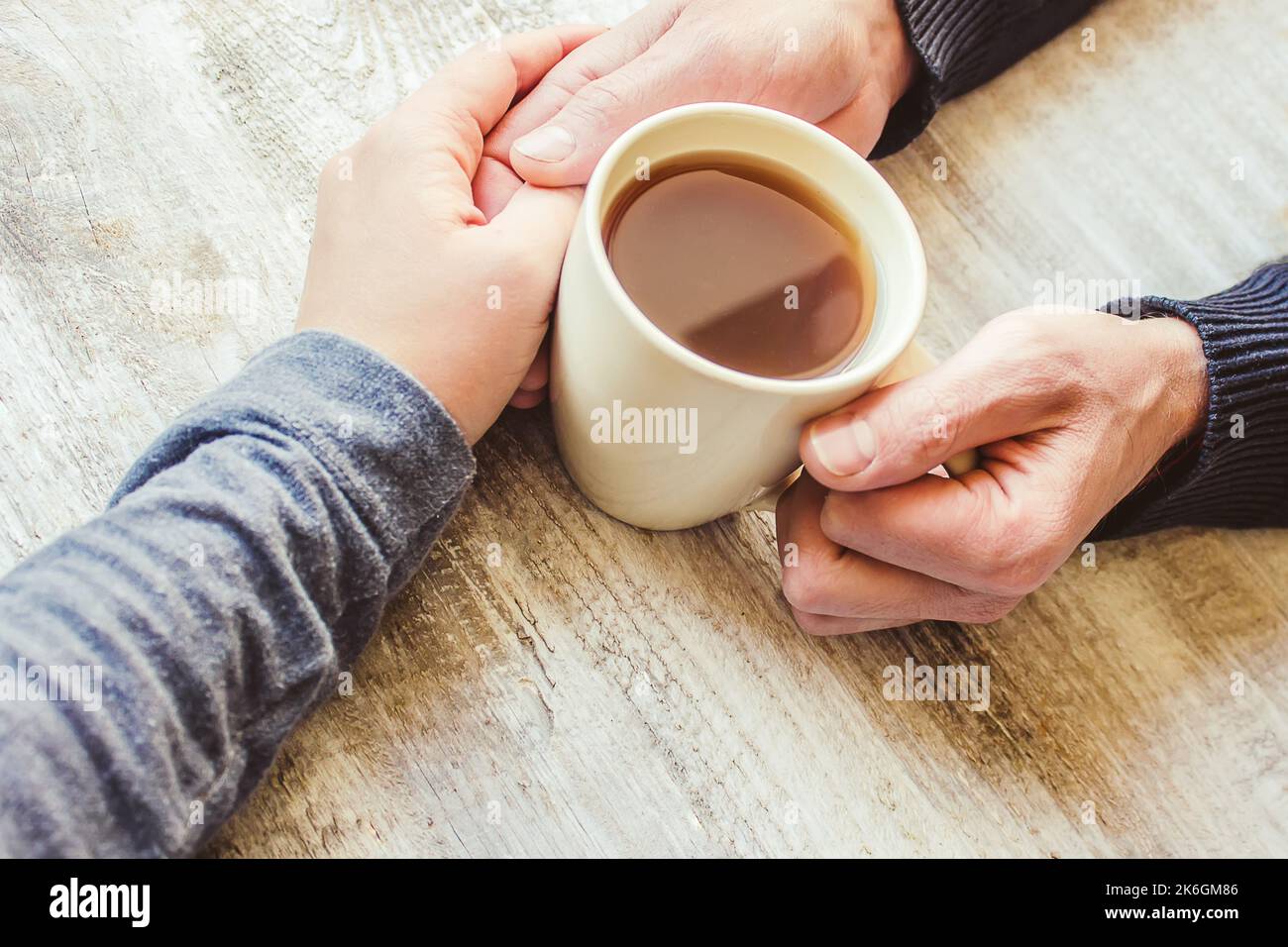 Tea in hand. The lovers are together. Selective focus. Drink Stock ...