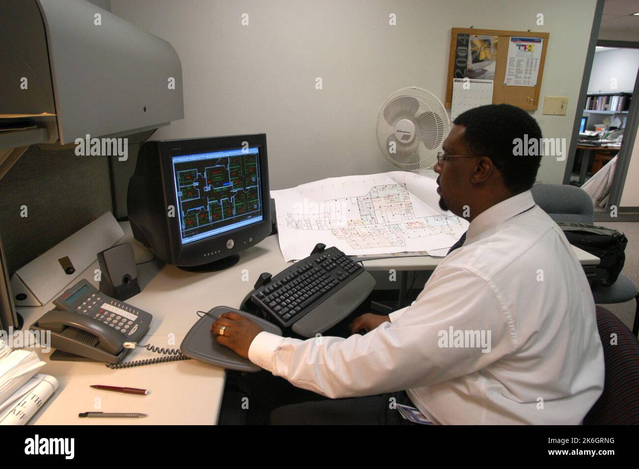 Views of Bureau of Administration staff in assorted work settings,  for use on 'What We Do' display board for April, 2004 awards ceremony Stock Photo