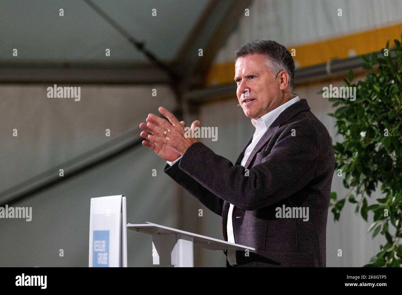 Grenzach Wyhlen, Germany. 14th Oct, 2022. Hagen Pfundner, CEO of Roche Pharma AG, speaks during an event on the remediation of the Kesslergrube. For more than two decades, the so-called Kesslergrube served as a waste disposal site for Grenzach-Wyhlen. The pharmaceutical company Roche also left waste here. Ten years after it began, Roche is now celebrating the completion of the extensive remediation work. Credit: Philipp von Ditfurth/dpa/Alamy Live News Stock Photo