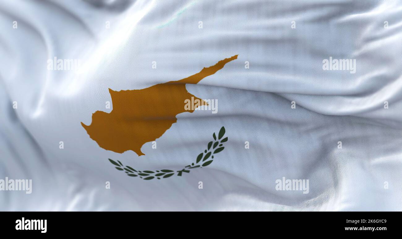 Close-up view of the Cyprus national flag waving in the wind. The Republic of Cyprus is an island country in the eastern Mediterranean Sea. Fabric tex Stock Photo