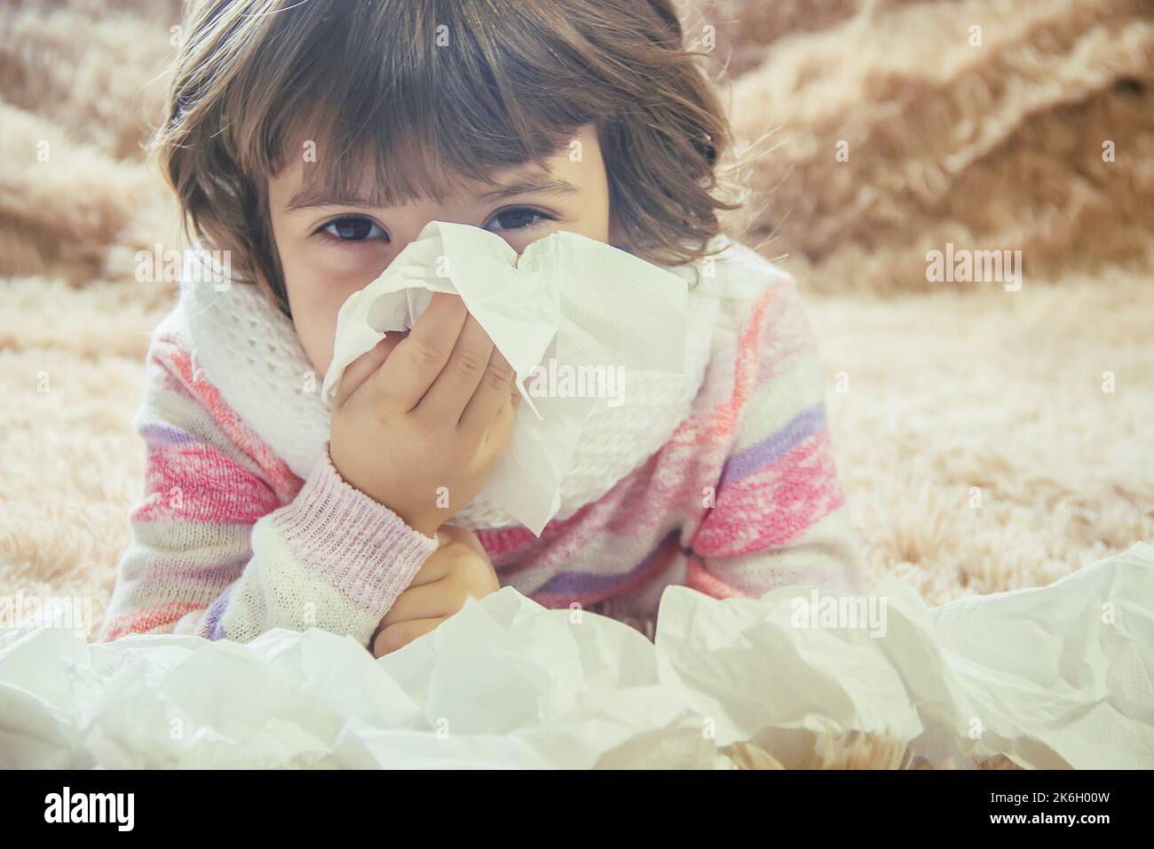 Cold at the child. Runny nose. Selective focus. Kids Stock Photo - Alamy