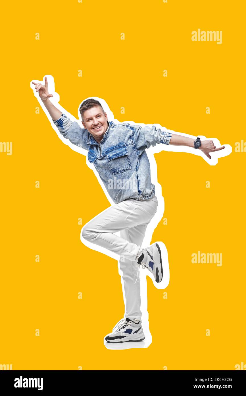 young man in denim clothes jumping and dancing . Stock Photo