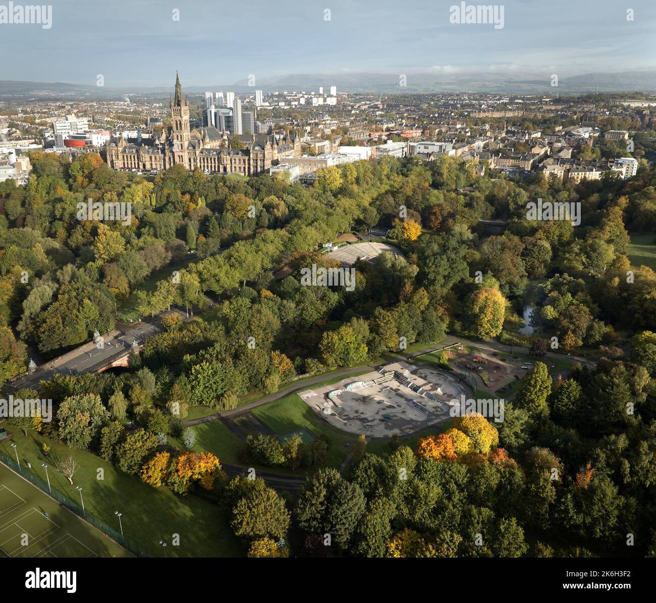 Aerial view of Kelvingrove Art Gallery and Museum and the University of Glasgow with the Bandstand and skatepark in Kelvingrove Park on a sunny autumn. Stock Photo