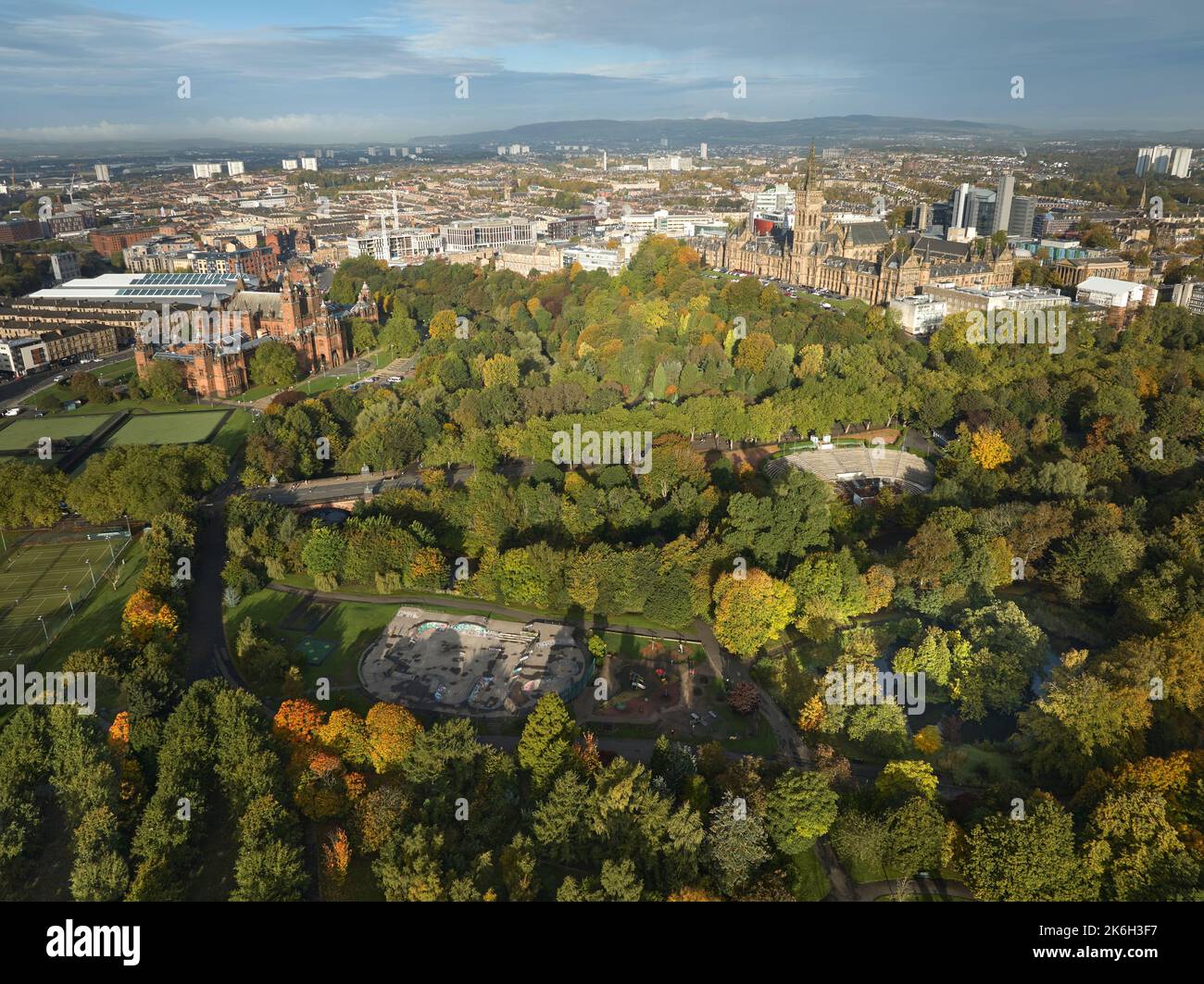 Aerial view of Kelvingrove Art Gallery and Museum and the University of Glasgow with the Bandstand and skatepark in Kelvingrove Park on a sunny autumn. Stock Photo