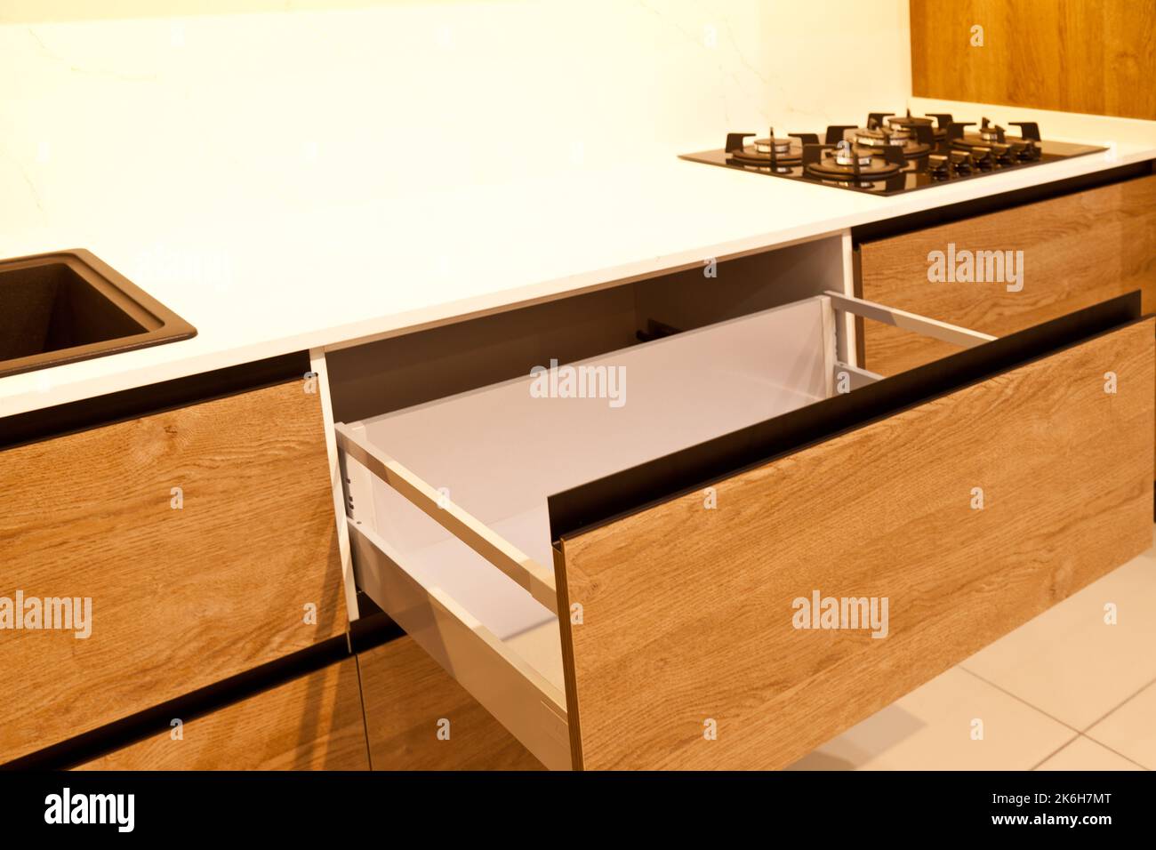 Small wooden drawers, part of wooden furniture in kitchen Stock Photo -  Alamy