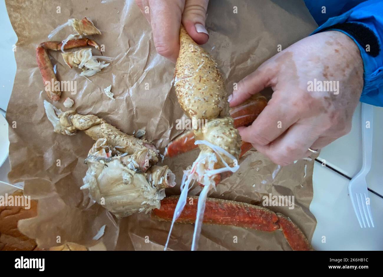 July 30, 2022, Juneau, Alaska, USA: Diners eat crab at Tracyâ€™s King Crab Shack in Juneau, Alaska Saturday July 30, 2022. The Alaska Department of Fish and Game has canceled the winter crab season in the Bering Sea for the first time ever, because of declining numbers of crabs.  The fall harvest of Bristol Bay red king crab has also been canceled for the second season in a row. (Credit Image: © Mark Hertzberg/ZUMA Press Wire) Stock Photo