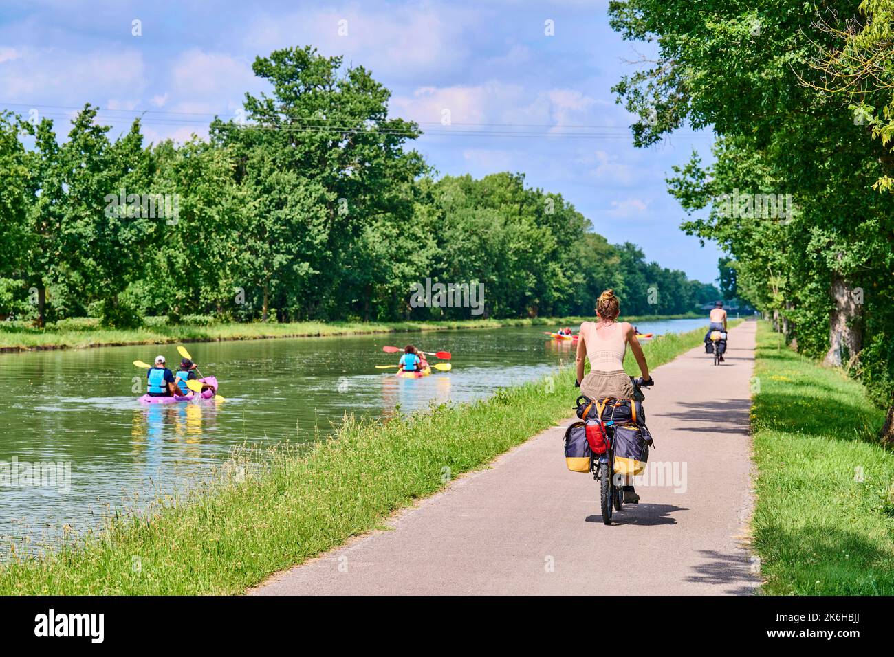 Canoe trip on the Canal lateral a la Garonne and the Canal de Montech linking Montauban and Montech, at the Montech water slope. Cyclists on a towpath Stock Photo