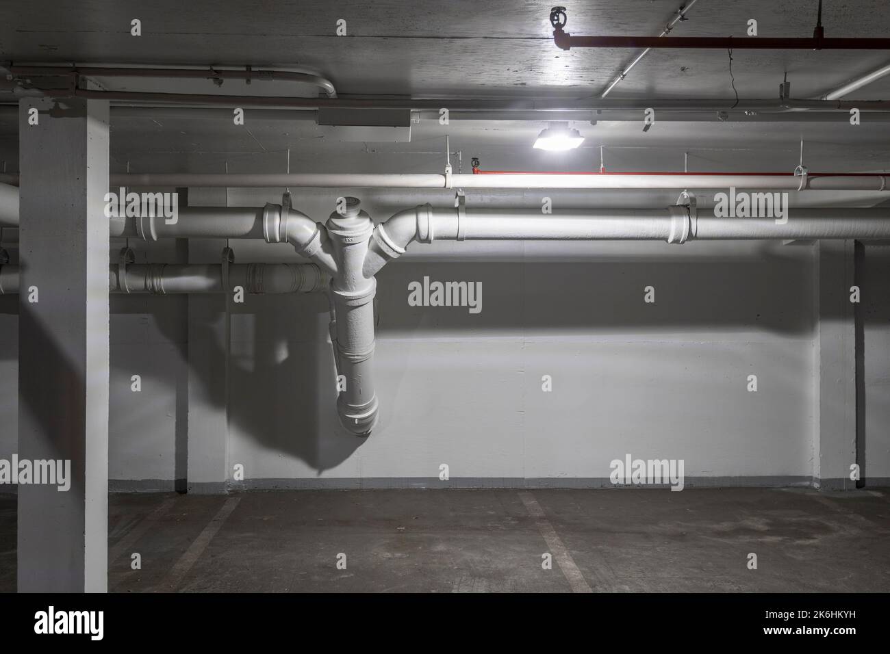 Exposed drainage pipes in underground parking garage, Philadelphia, Pennsylvania, USA Stock Photo