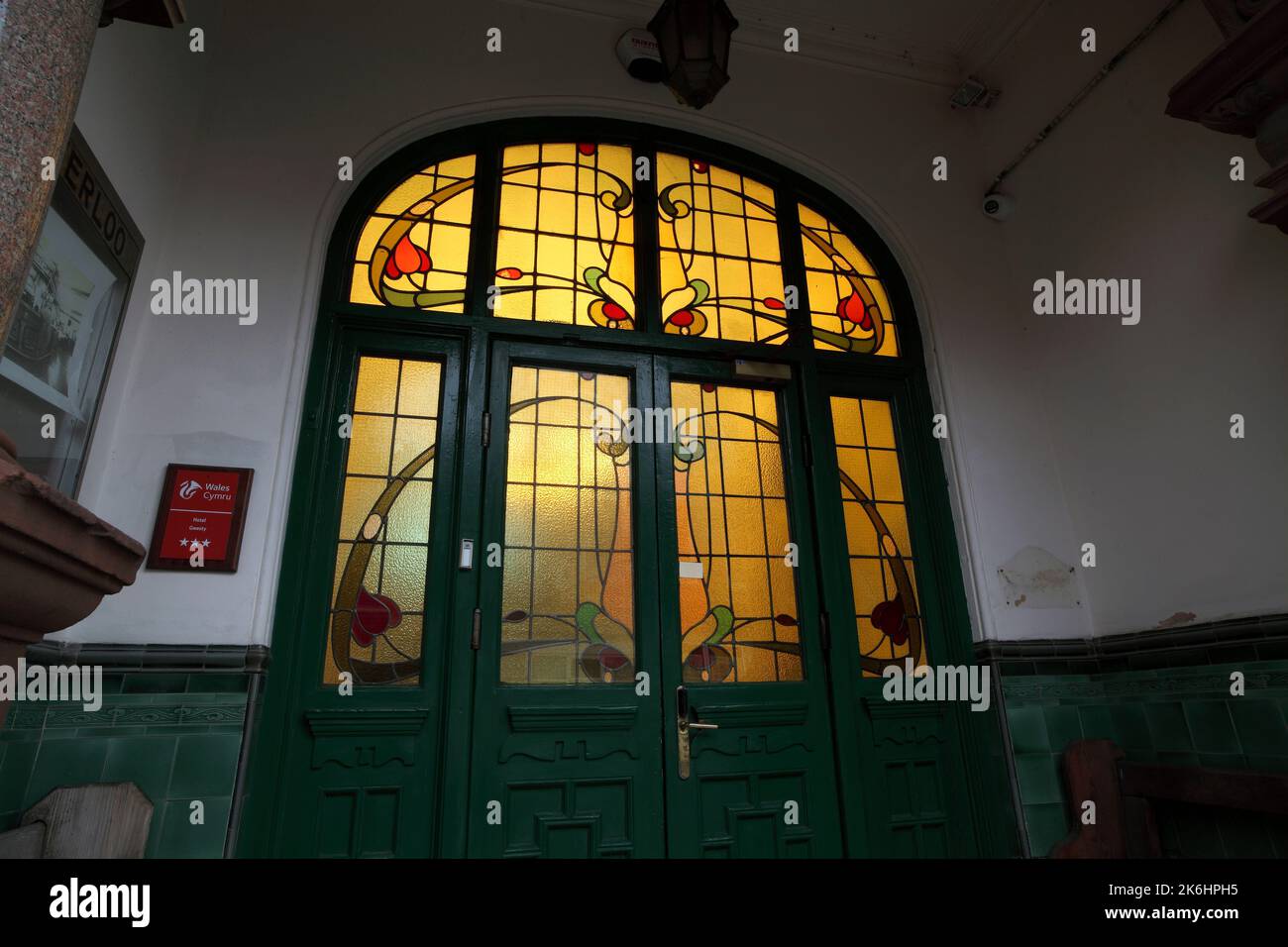 Art Nouveau glass in the entrance to the Waterloo Hotel, Newport, South Wales. Stock Photo