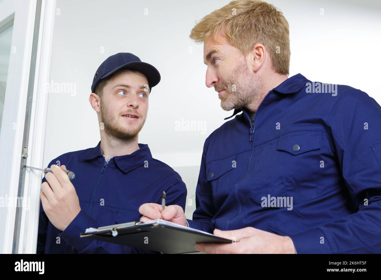 pvc foreman installer inspecting the job done Stock Photo Alamy