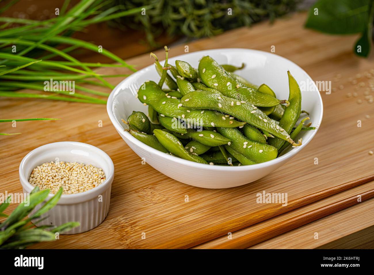 Green pea pods with sesame seeds. Diet food concept Stock Photo