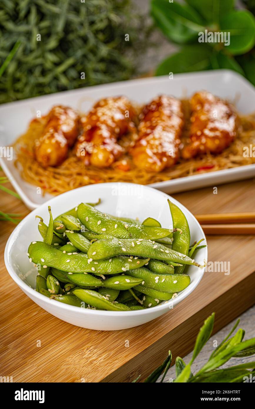 Famous Chinese cuisine dishes on table. Green pea pods Stock Photo