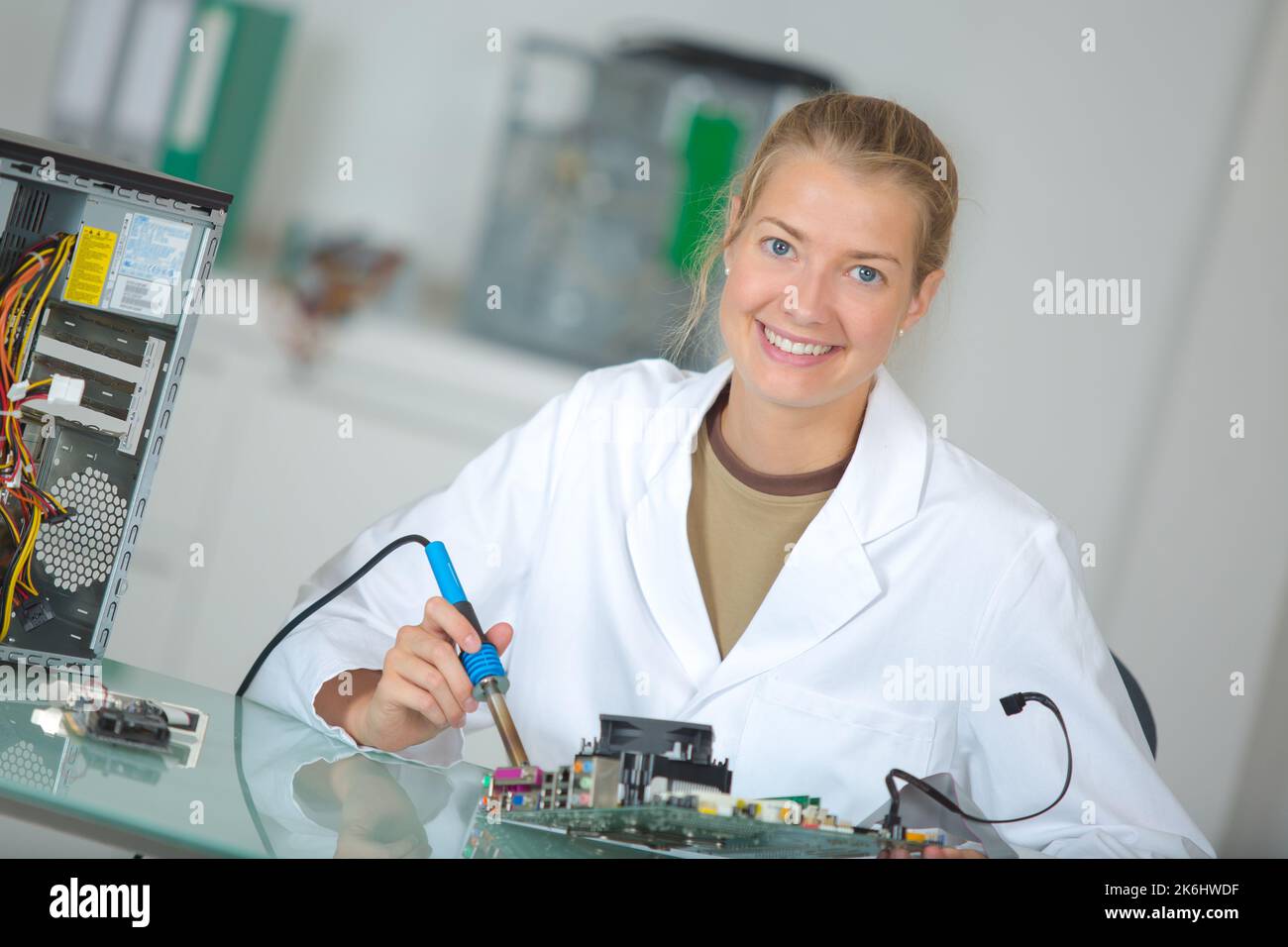 female technician soldering electronic components Stock Photo Alamy