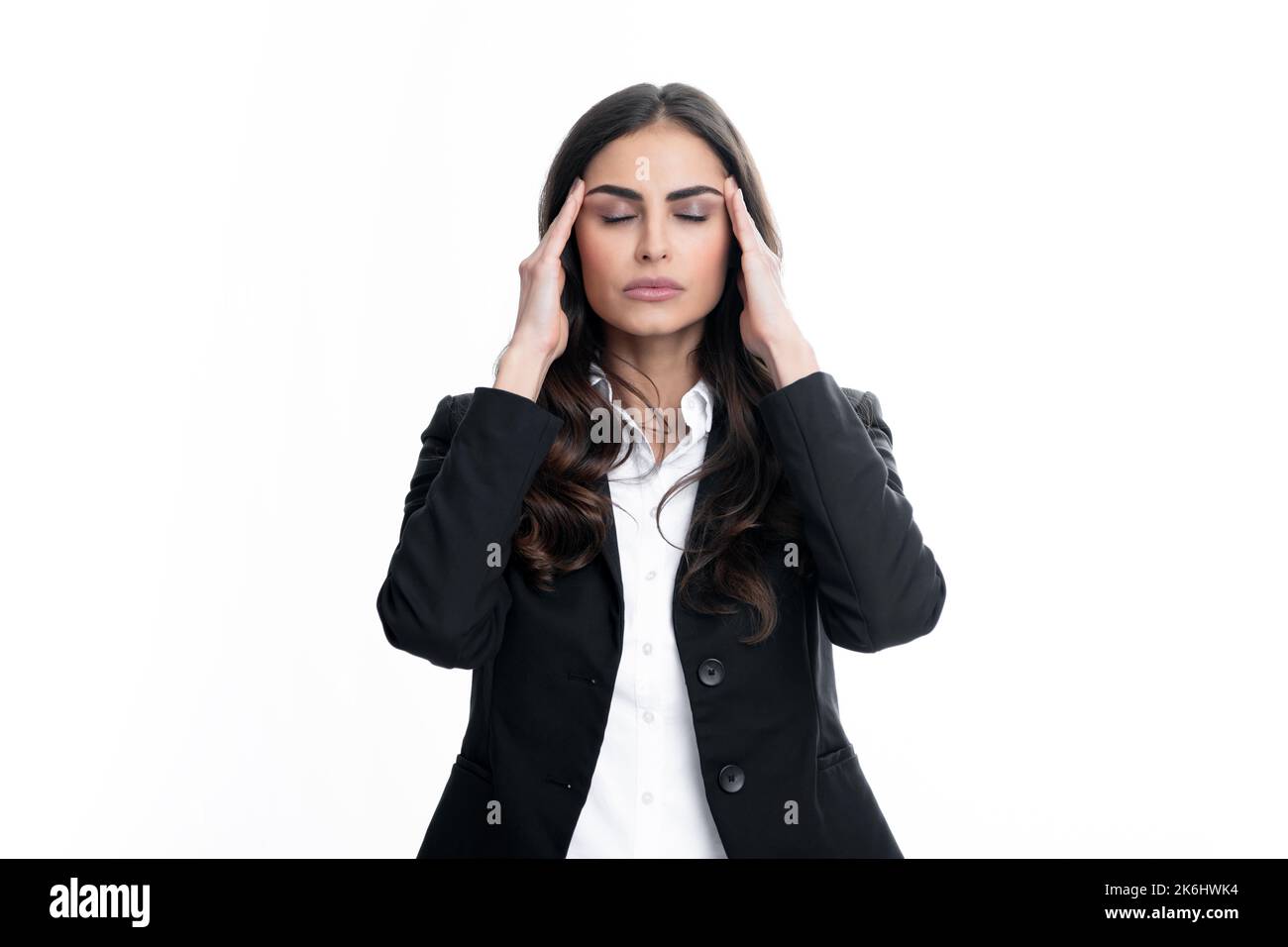 Portrait of young woman feeling stress or strain headache. Female student, young teacher. Upset sad depressed model with hands on head. Stock Photo