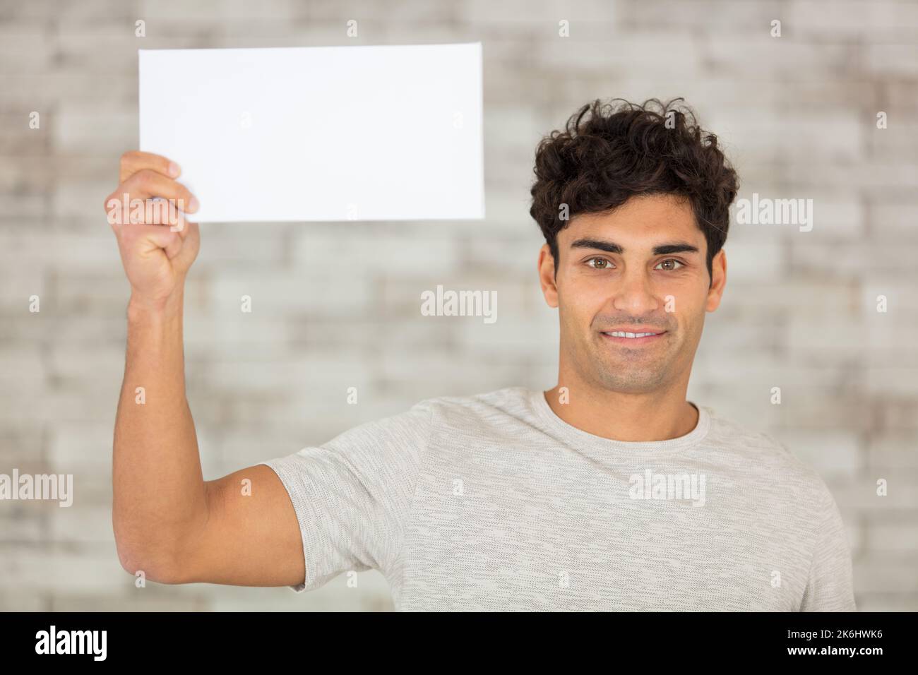young man showing a blank board Stock Photo Alamy