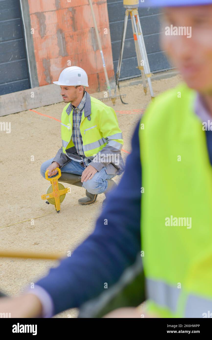 a man is using a geometers Stock Photo